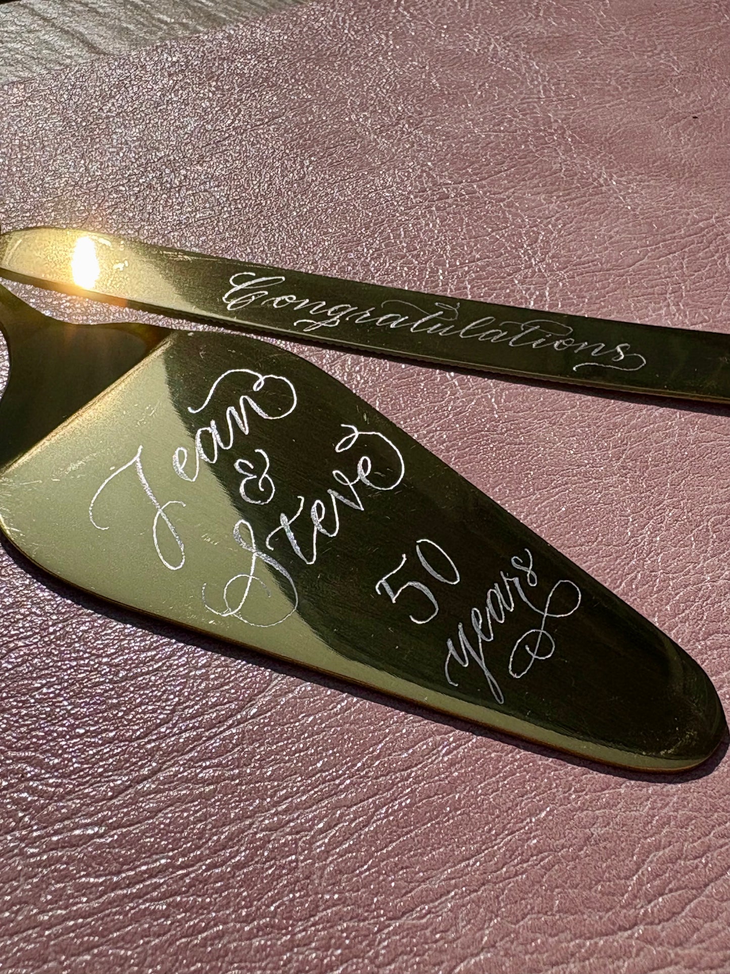 hand engraved stainless cake server personalised with elegant calligraphy available in the UK perfume fragrance calligraphy engraving customisation personalisation service in Hampshire London Surrey Berkshire UK bridal party ideas wedding guests luxury gift ideas for loved ones engraved with calligraphy name handmade Jodie Rose Calligraphy