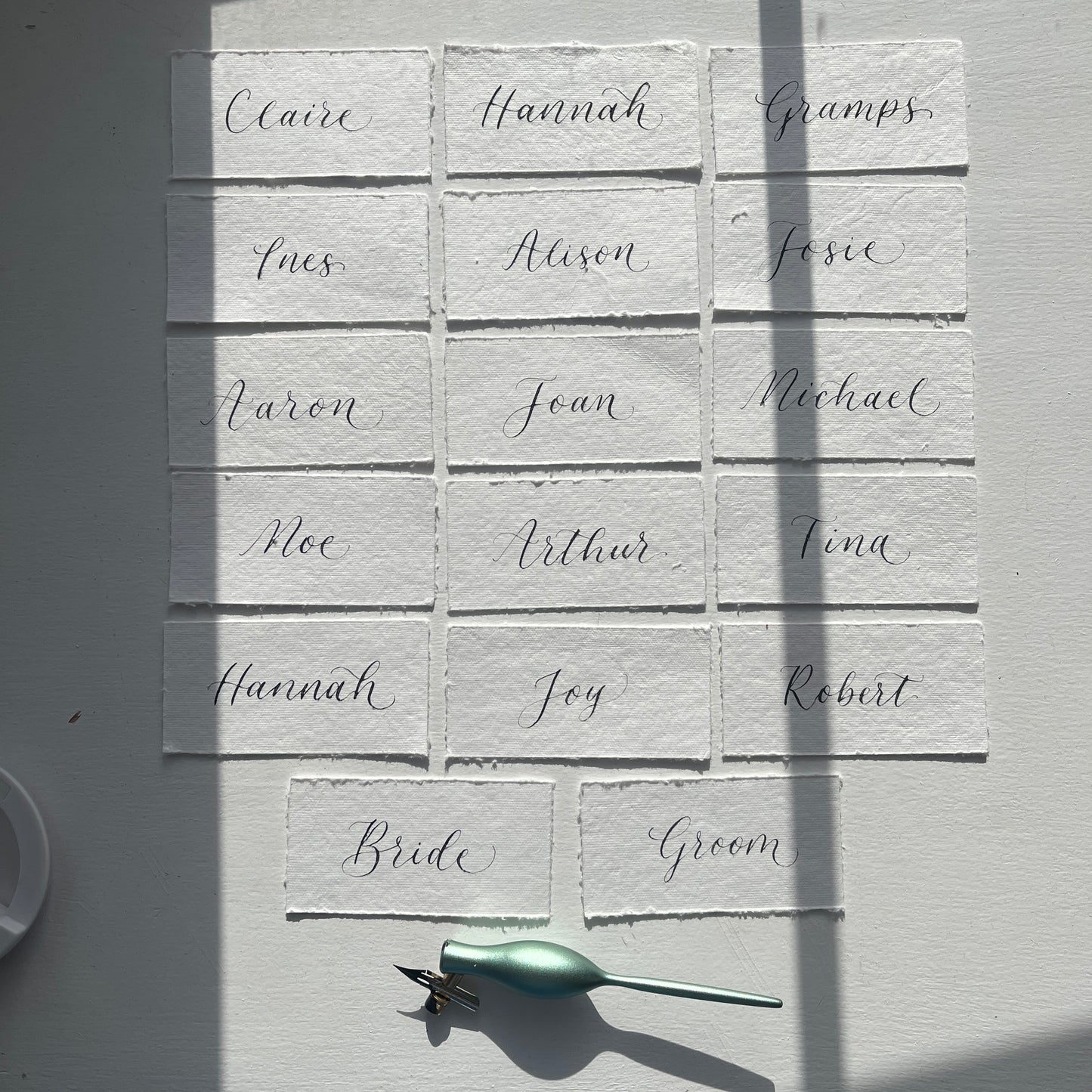 Handmade rag cotton paper with handwritten flourished calligraphy by Jodie Rose Calligraphy in Hampshire for weddings and events