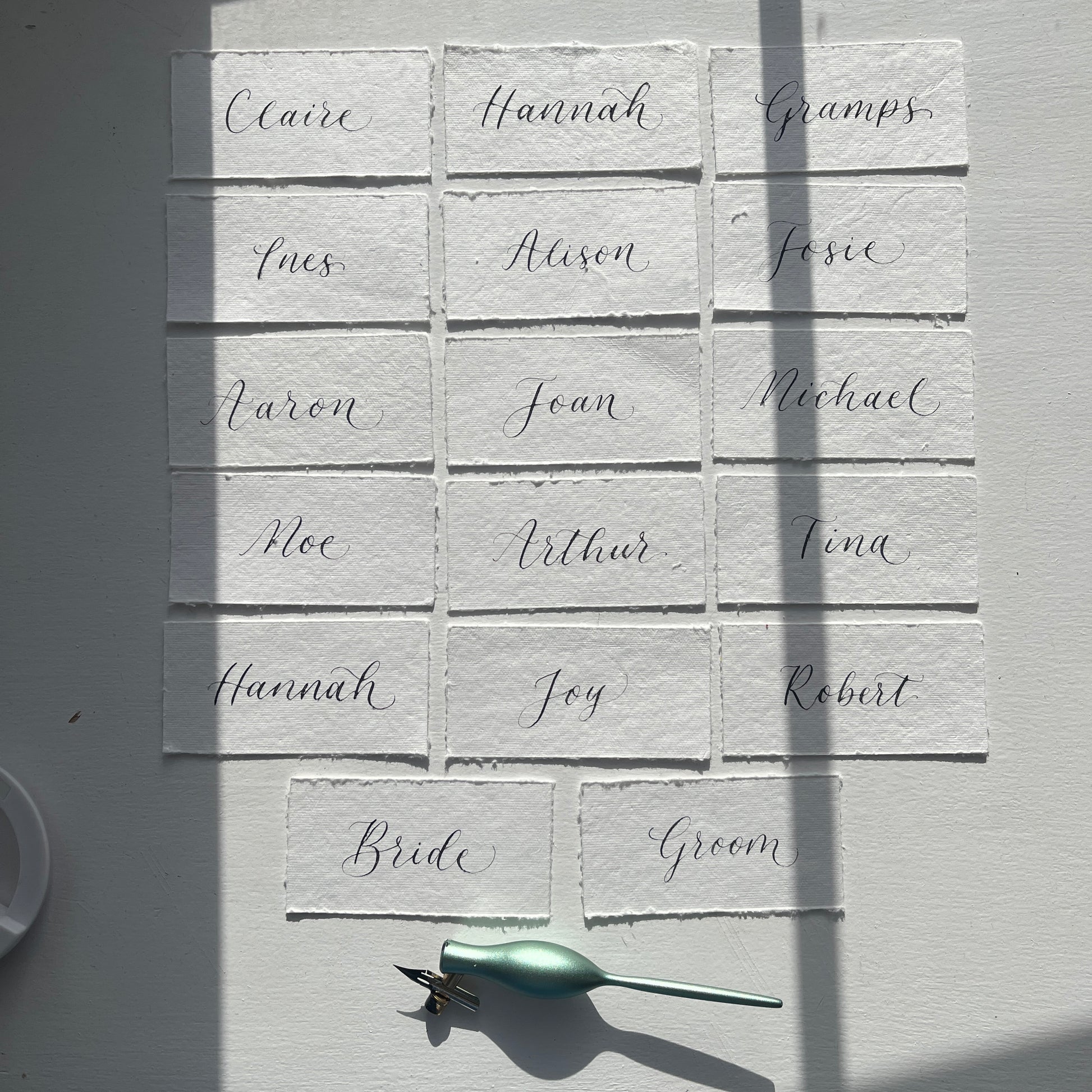Handmade rag cotton paper with handwritten flourished calligraphy by Jodie Rose Calligraphy in Hampshire for weddings and events