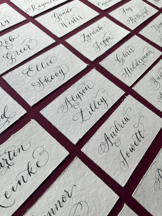 Handmade rag cotton paper with handwritten flourished calligraphy by Jodie Rose Calligraphy in Hampshire for weddings and events