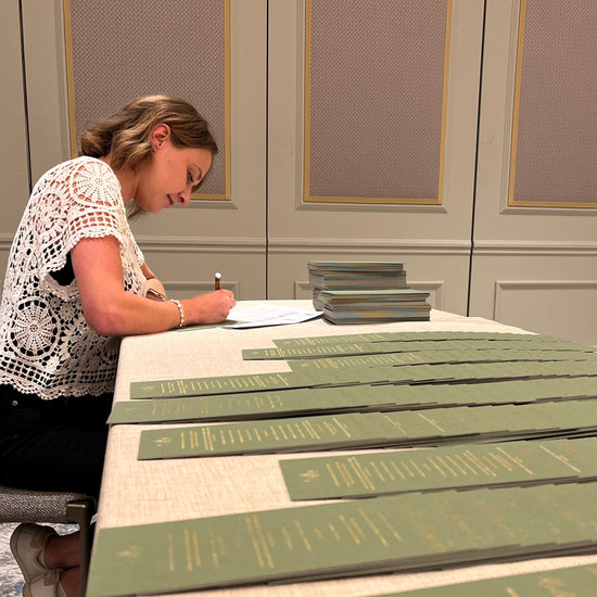 Handwritten calligraphy names on menus for an event at The Four Seasons Hotel in Hampshire